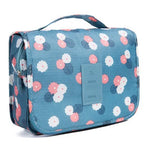 trousse-de-toilette-bleue-fleurs-avec-compartiment-femme