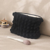 trousse-de-toilette-noire-matelassee-femme